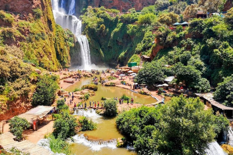 Ouzoud Falls in Morocco, showcasing cascading waterfalls and lush greenery.